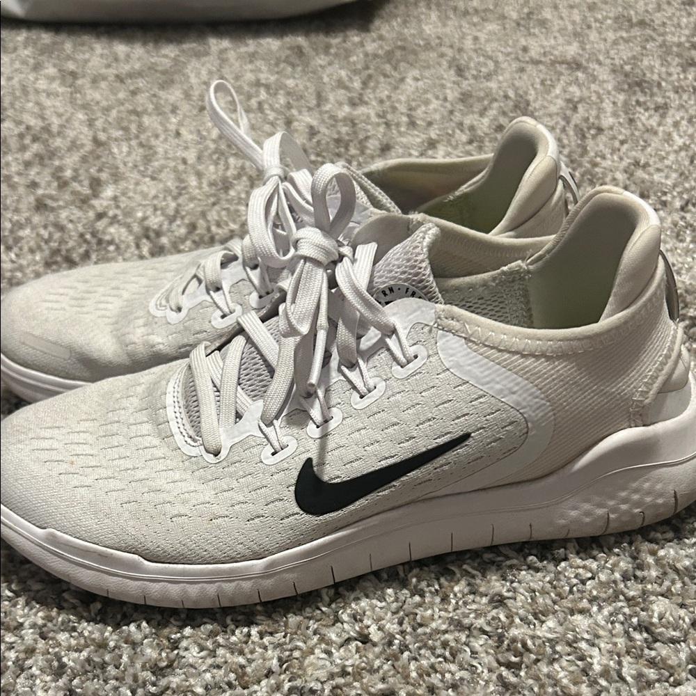 Nike Light Gray Running Shoes with Black Logo